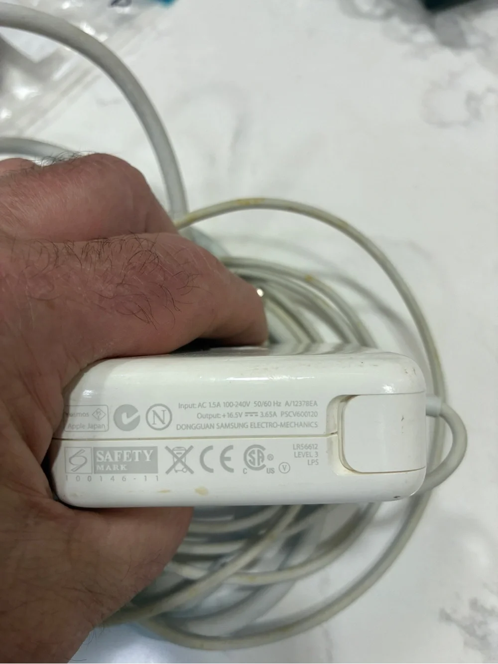 PSCV600120 is an Apple 60W MagSafe 1 power adapter